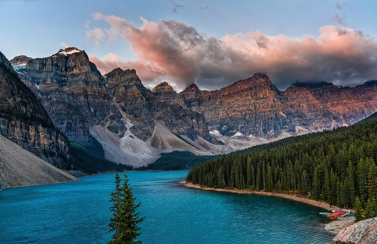 Pink clouds over the peaks at Moraine Lake at sunrise
